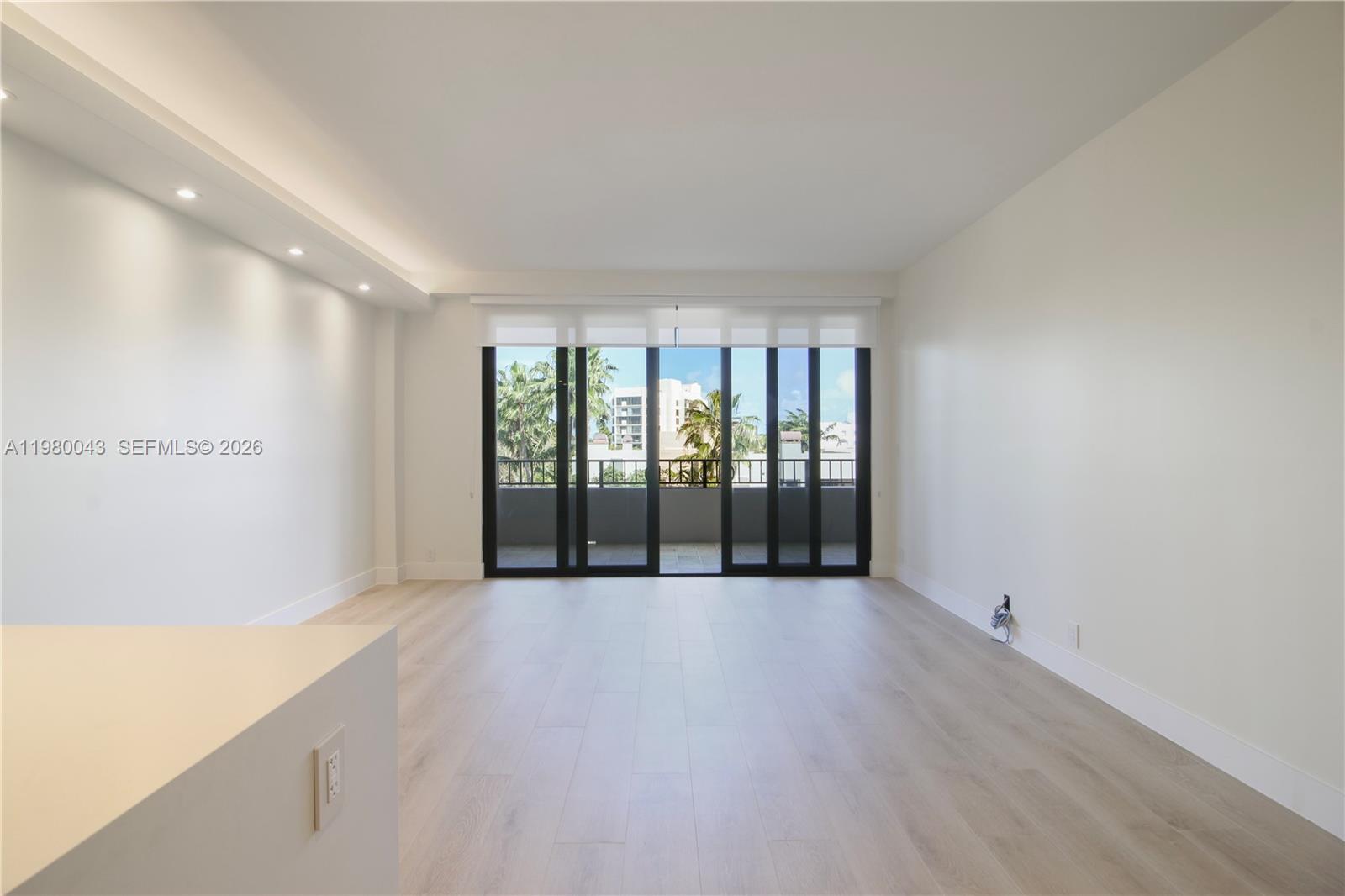 151 Crandon Boulevard, Unit 540 Key Biscayne, FL 33149 - Photo 19 of 40 a view of an empty room with wooden floor and a window