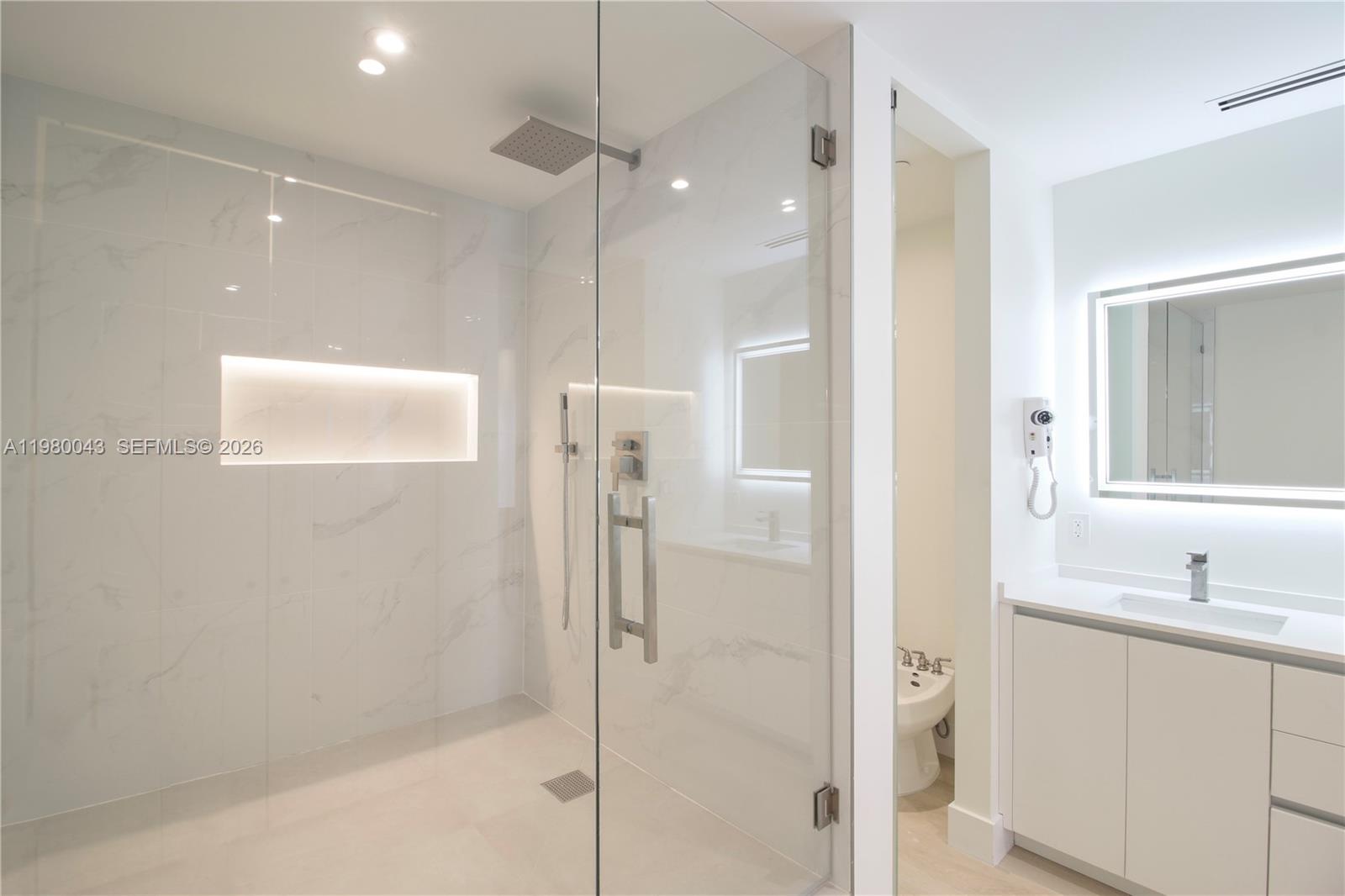 151 Crandon Boulevard, Unit 540 Key Biscayne, FL 33149 - Photo 40 of 40 a bathroom with a shower and a sink