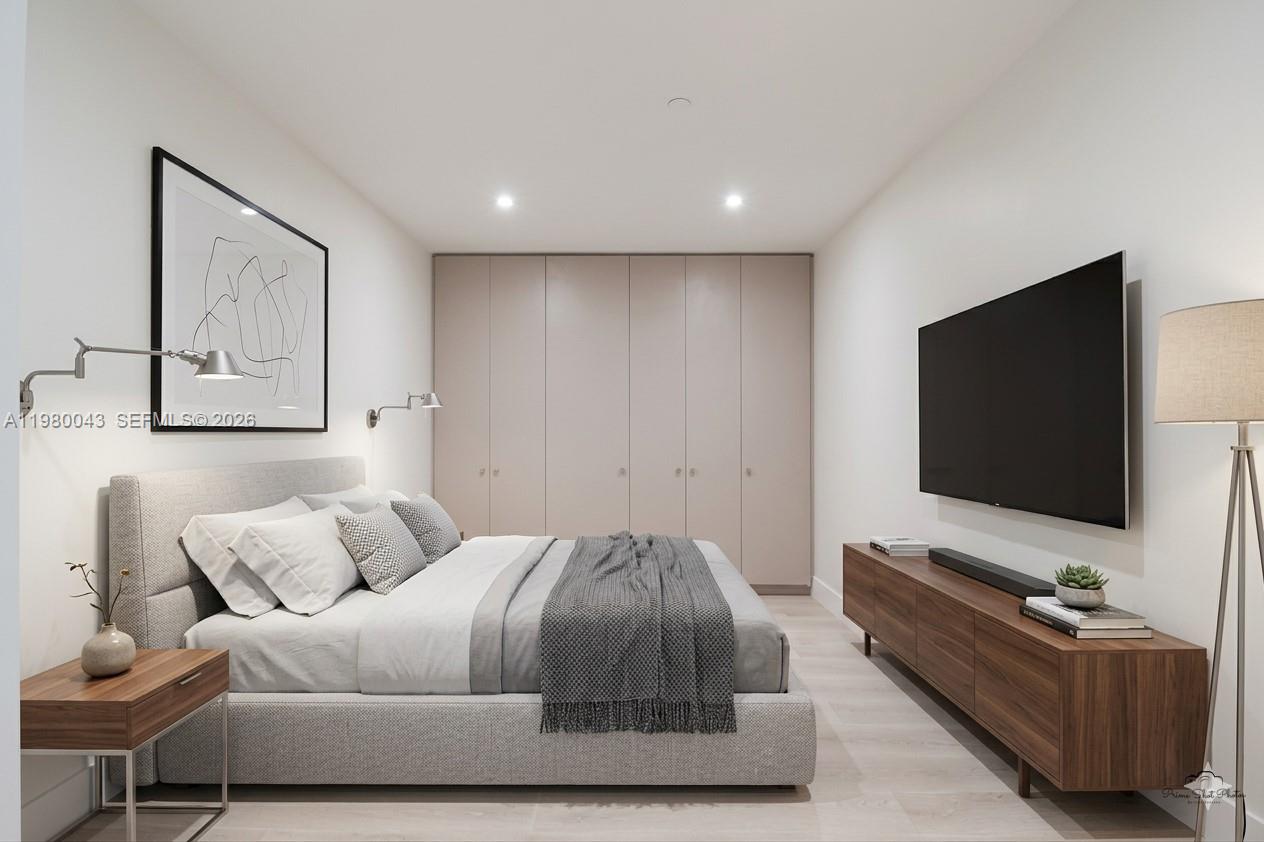 151 Crandon Boulevard, Unit 540 Key Biscayne, FL 33149 - Photo 4 of 40 a living room with furniture and a flat screen tv