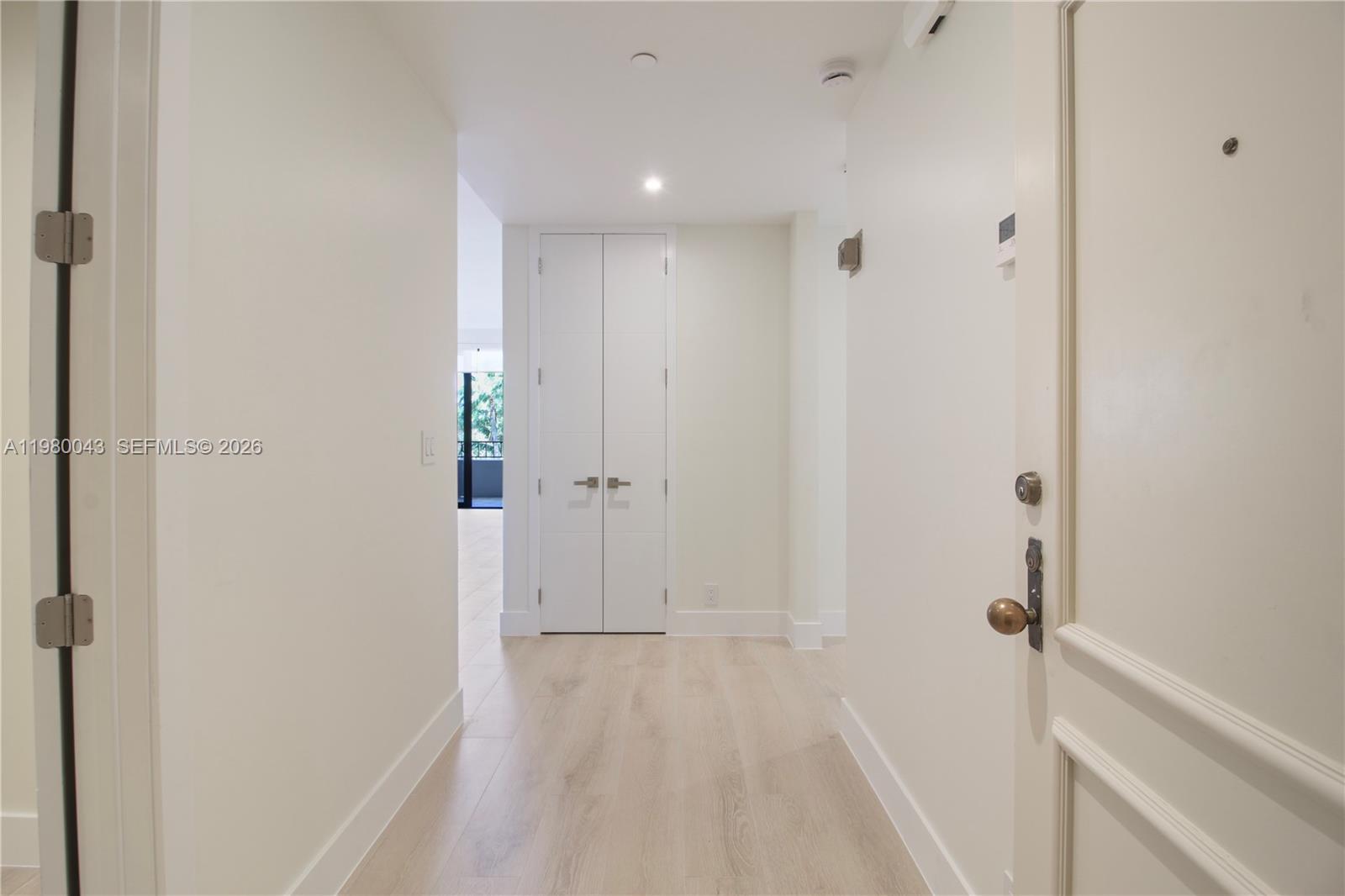 151 Crandon Boulevard, Unit 540 Key Biscayne, FL 33149 - Photo 9 of 40 a view of a hallway with wooden floor
