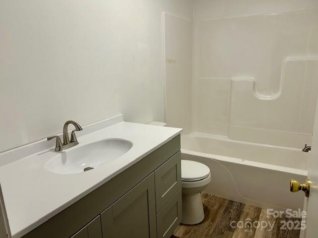 1375 Bradford Mountain Road Lenoir, NC 28645 - Photo 18 of 21 a bathroom with a sink a toilet and a bathtub