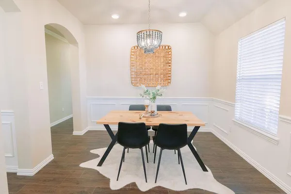 a view of a dining room with furniture and window