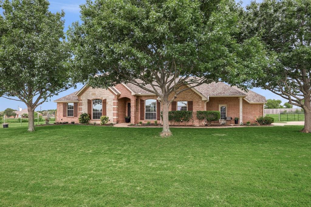 1377 Block Road Gunter, TX 75058 - Photo 2 of 37 a front view of a house with a garden