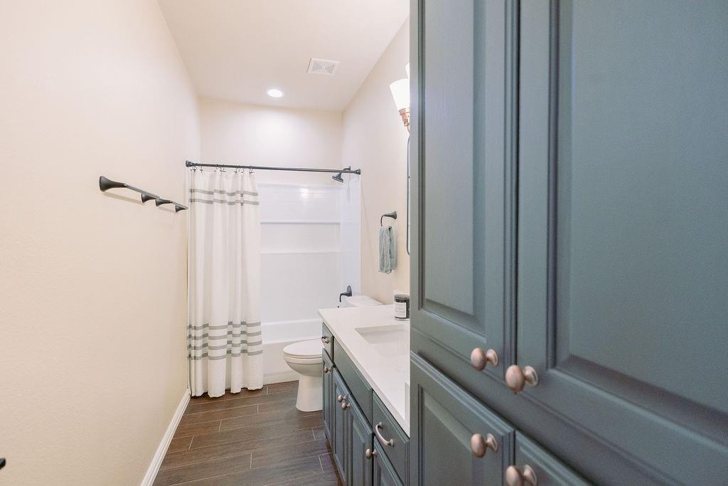 1377 Block Road Gunter, TX 75058 - Photo 22 of 37 a bathroom with a sink and a mirror