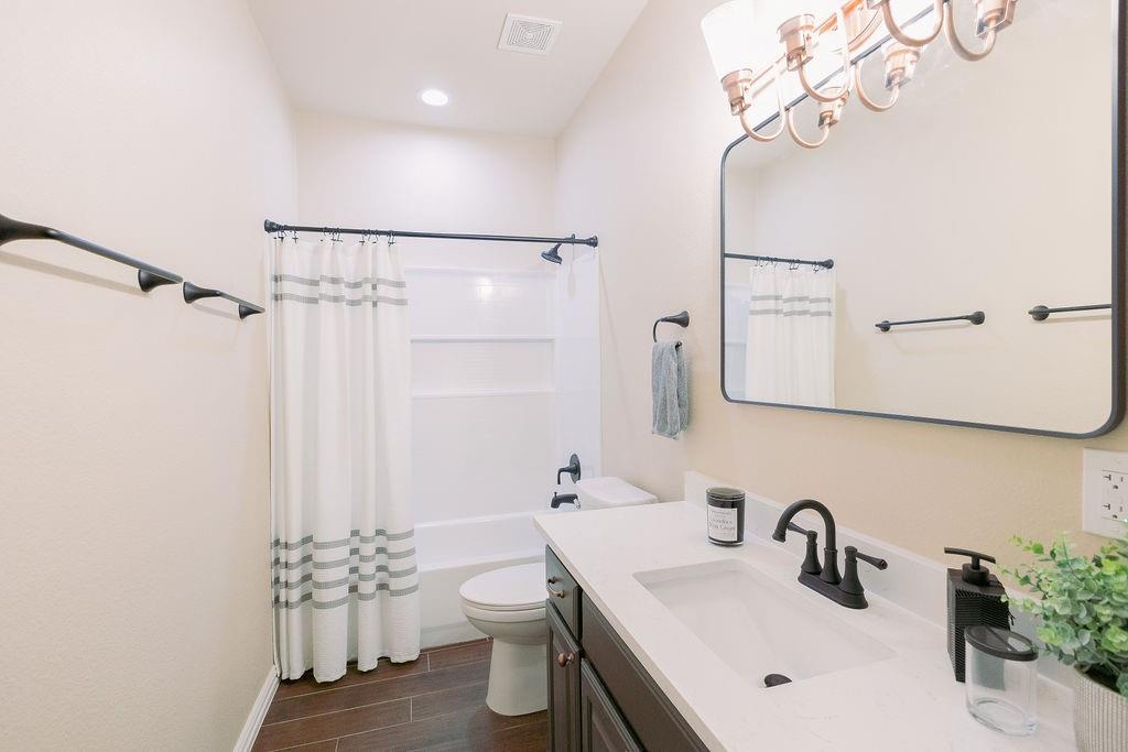 1377 Block Road Gunter, TX 75058 - Photo 23 of 37 a bathroom with a sink and a mirror