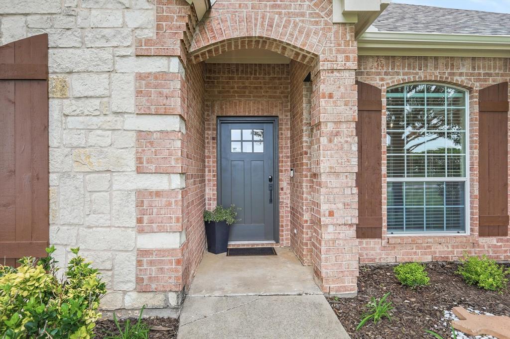 1377 Block Road Gunter, TX 75058 - Photo 3 of 37 a front view of a house with potted plants