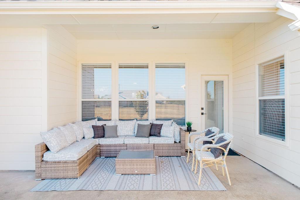 1377 Block Road Gunter, TX 75058 - Photo 32 of 37 a living room with furniture and a large window