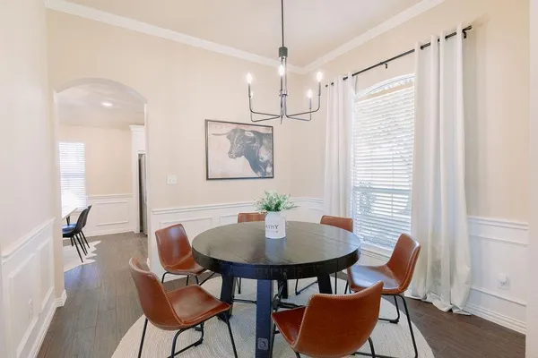 a dining room with furniture and window