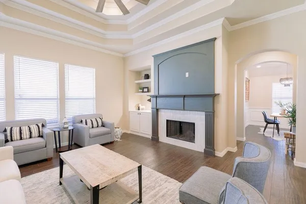 a living room with furniture and a fireplace