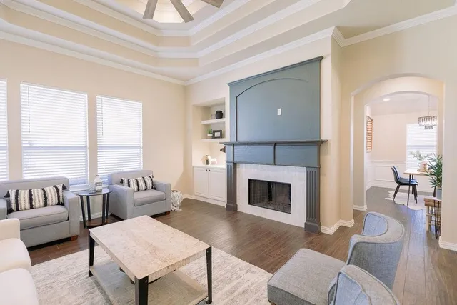 a living room with furniture and a fireplace