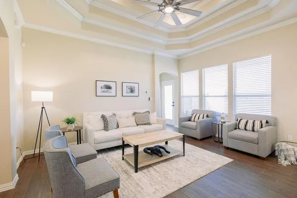 a living room with furniture and a large window