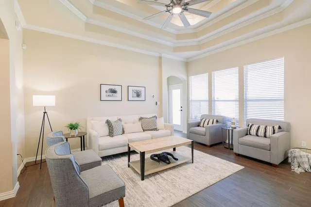 a living room with furniture and a large window