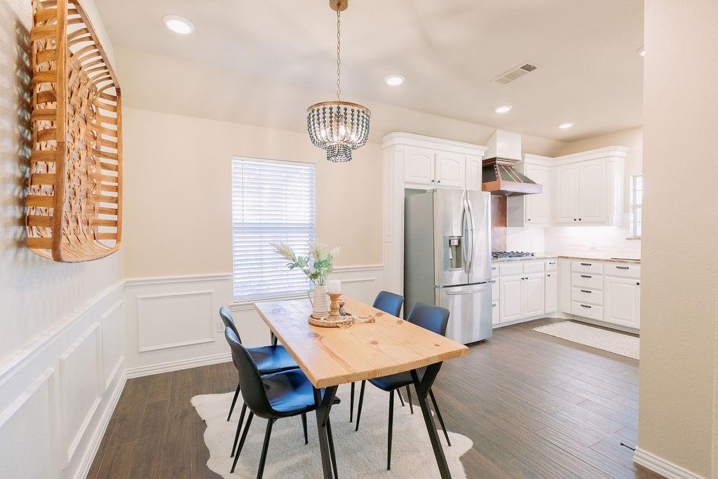 1377 Block Road Gunter, TX 75058 - Photo 10 of 37 a view of a dining room with furniture large window and wooden floor