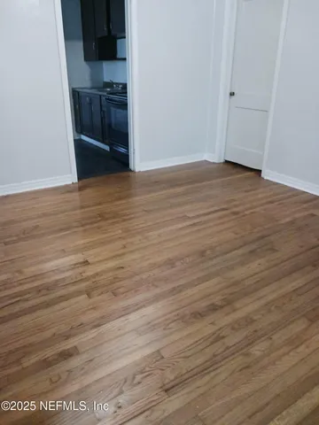 a view of a kitchen from the hallway