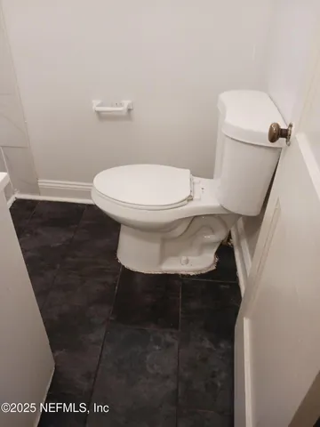 a bathroom with a toilet and a sink