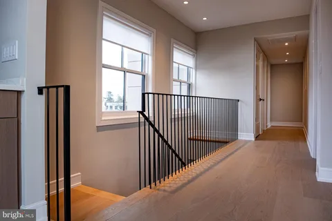 a large bedroom with a large bed and a window