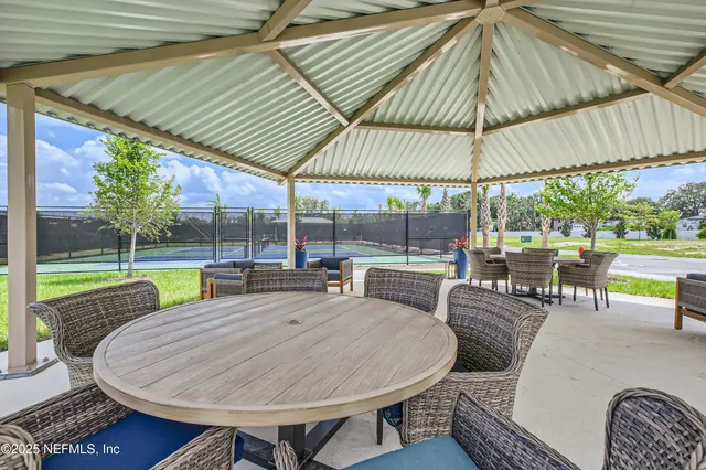 swimming pool view with a seating space