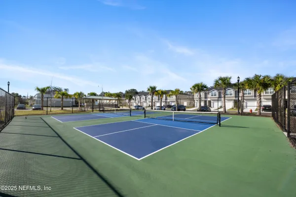 a view of an outdoor space and tennis court