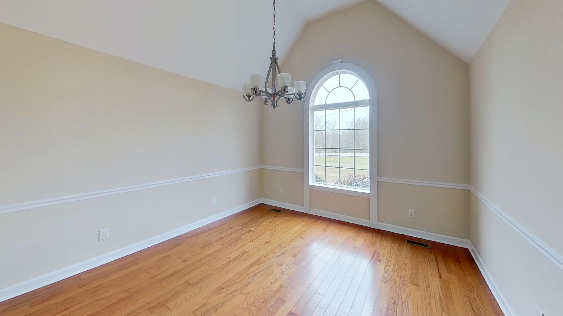 2136 Clara Mathis Road Spring Hill, TN 37174 - Photo 14 of 23 an empty room with wooden floor fan and windows
