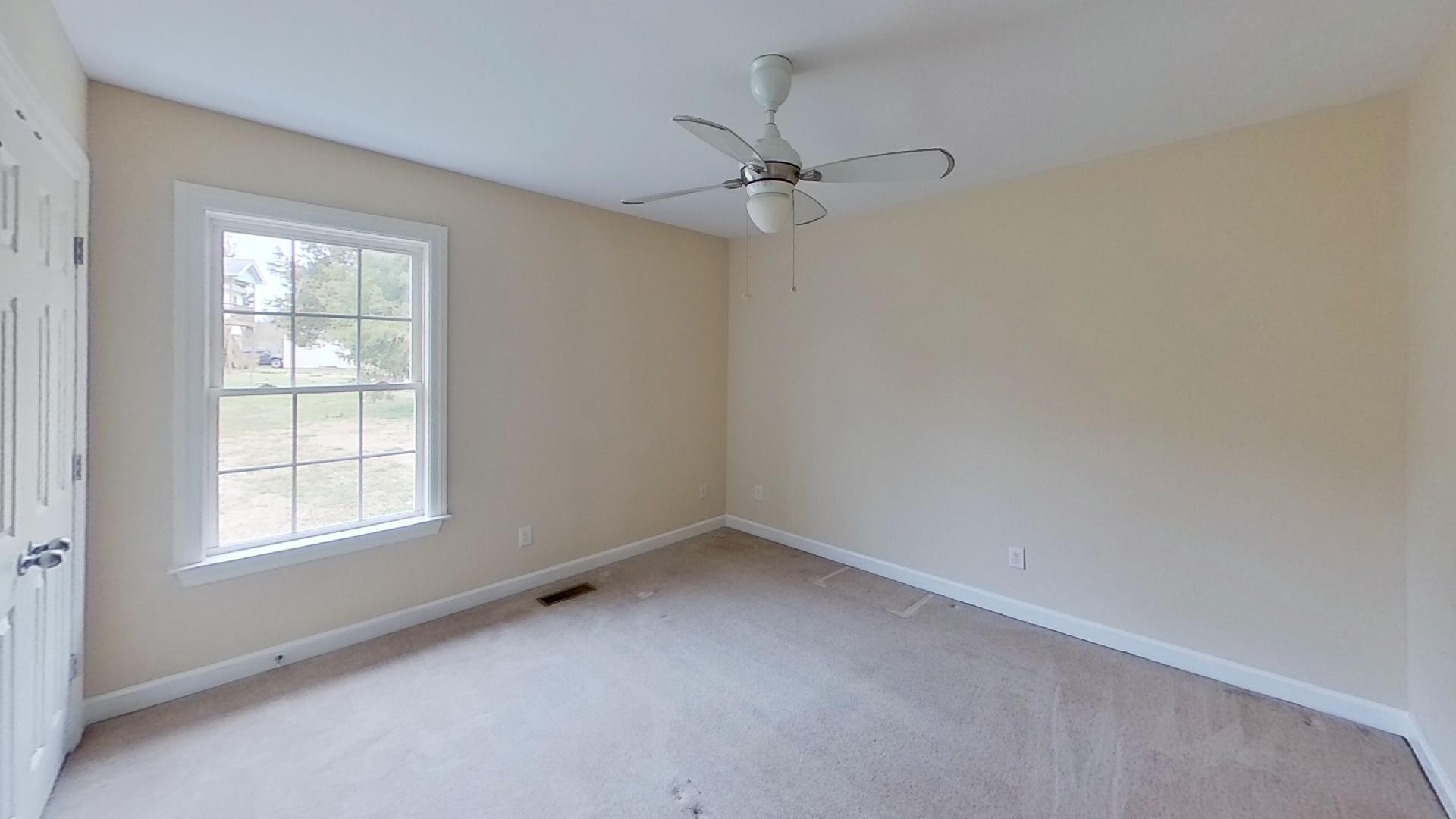 2136 Clara Mathis Road Spring Hill, TN 37174 - Photo 19 of 23 an empty room with a window and a fan