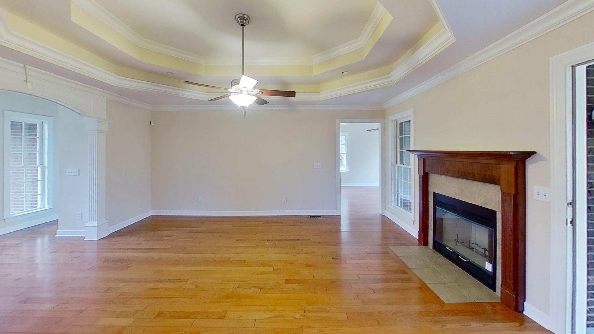 2136 Clara Mathis Road Spring Hill, TN 37174 - Photo 21 of 23 a view of an empty room with chandelier and fireplace