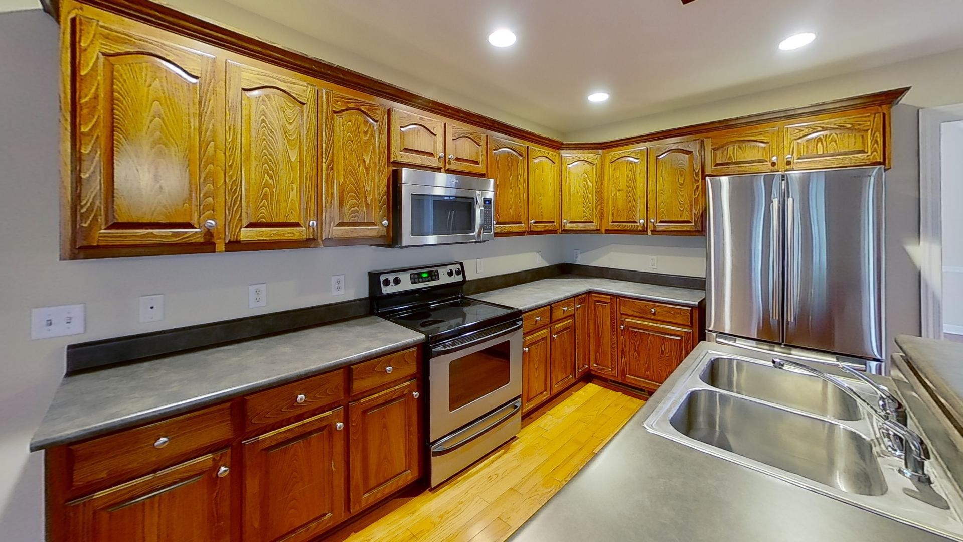 2136 Clara Mathis Road Spring Hill, TN 37174 - Photo 9 of 23 a kitchen that has a sink and a stove top oven