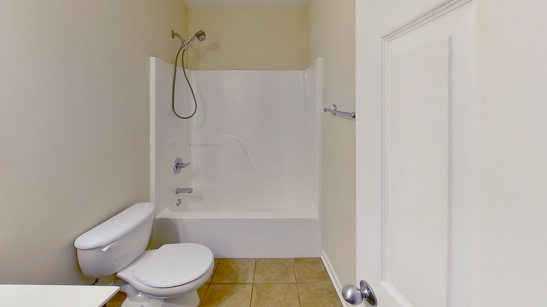 2136 Clara Mathis Road Spring Hill, TN 37174 - Photo 10 of 23 a bathroom with a toilet and shower