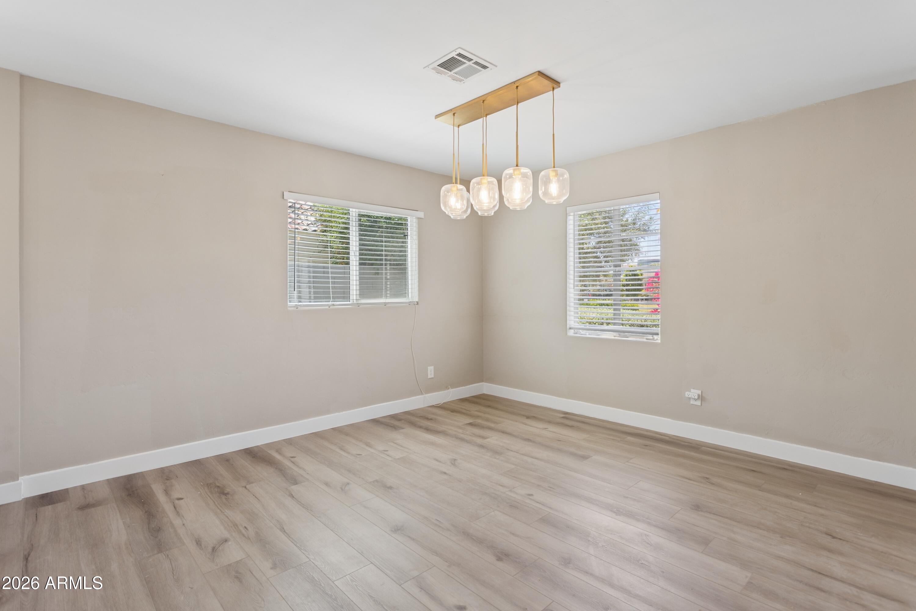 322 West Coronado Road Phoenix, AZ 85003 - Photo 15 of 93 wooden floor in an empty room with a window
