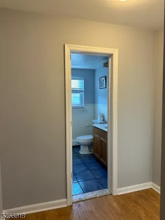 a view of a bathroom from a hallway