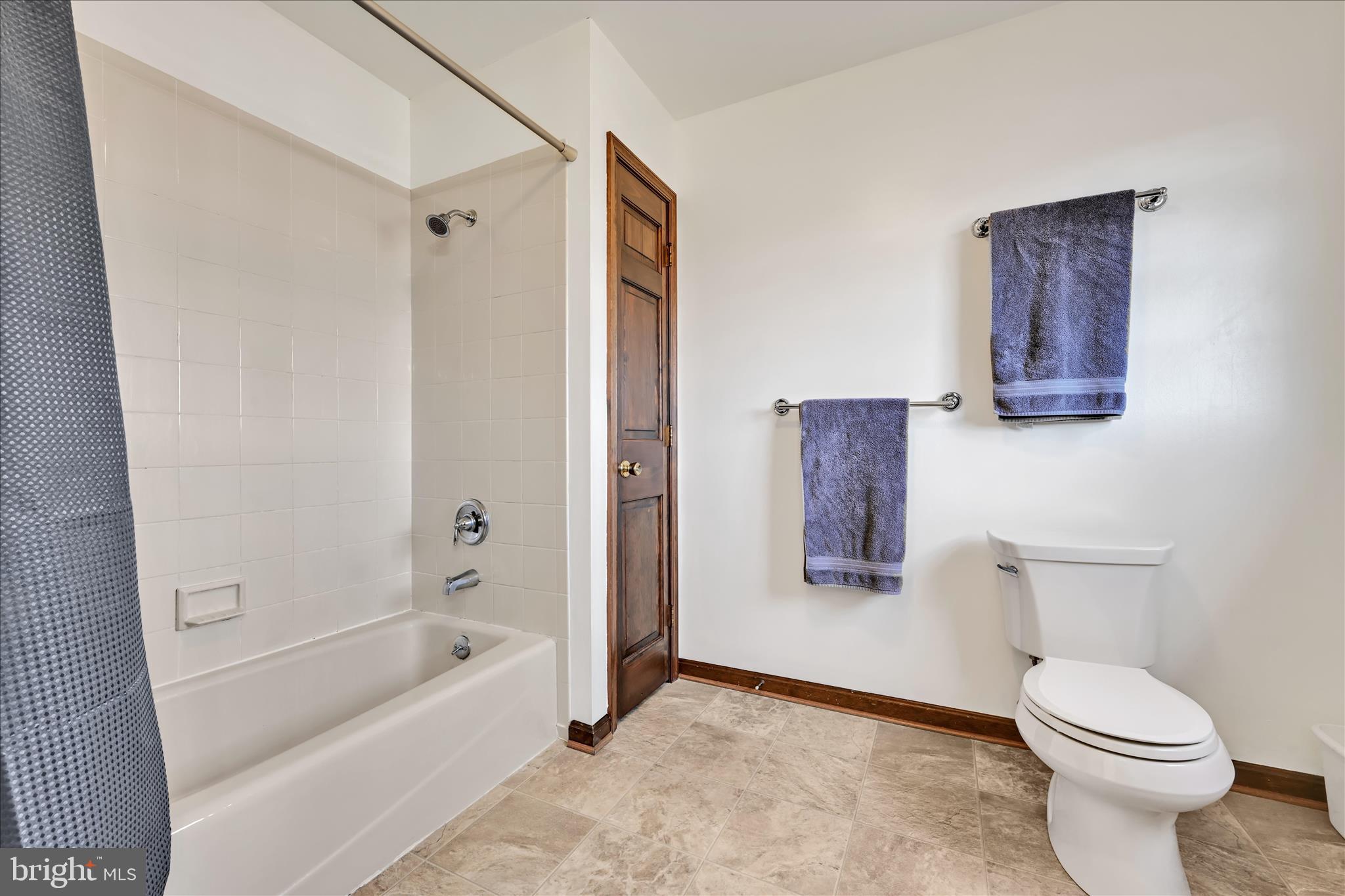 921 Acri Road Mechanicsburg, PA 17050 - Photo 18 of 46 a bathroom with a toilet sink and shower