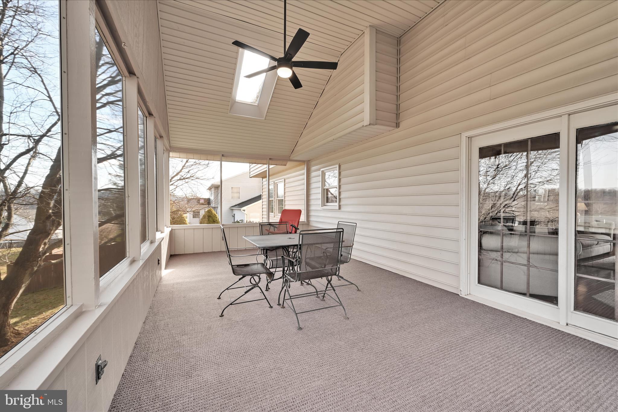 921 Acri Road Mechanicsburg, PA 17050 - Photo 32 of 46 a dining room with furniture and a floor to ceiling window