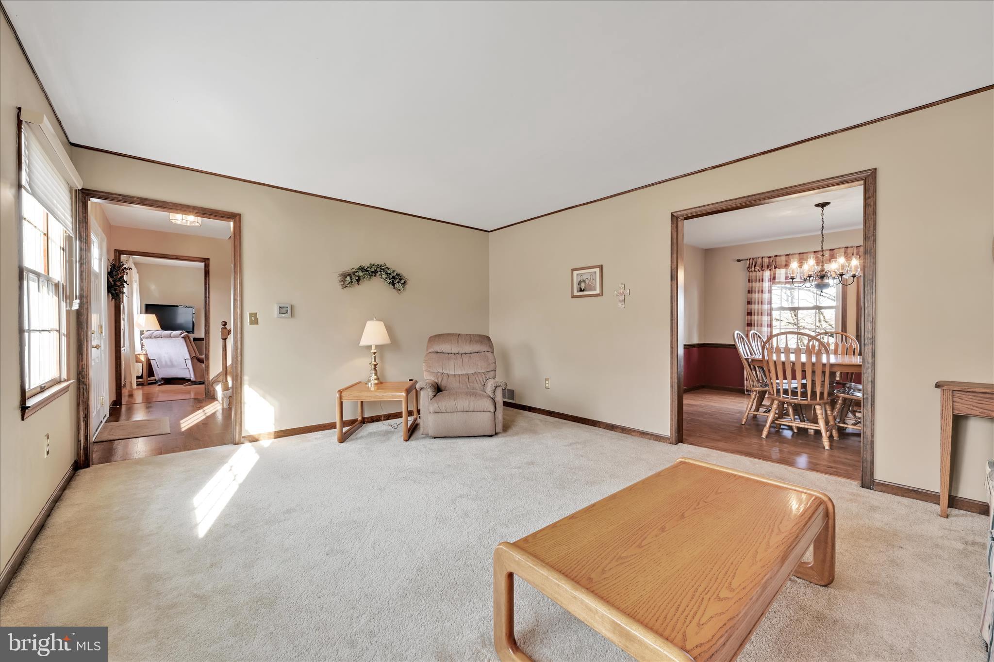 921 Acri Road Mechanicsburg, PA 17050 - Photo 4 of 46 a living room with furniture and a table