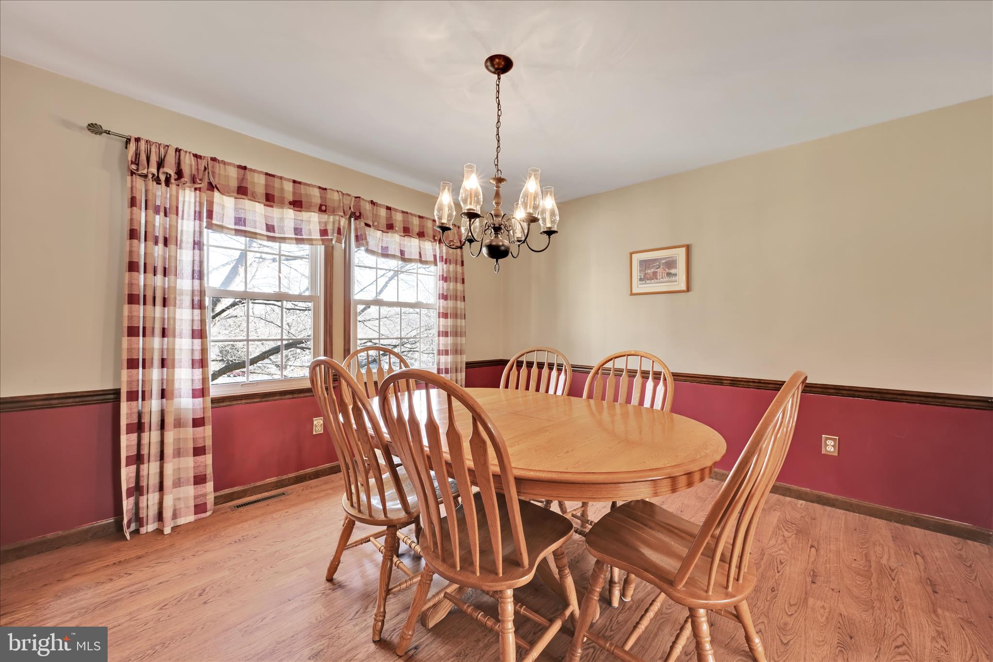 921 Acri Road Mechanicsburg, PA 17050 - Photo 6 of 46 a dining room with furniture a chandelier and wooden floor