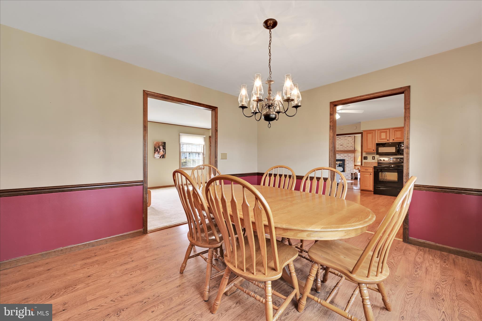 921 Acri Road Mechanicsburg, PA 17050 - Photo 7 of 46 a view of a dining room with furniture and chandelier