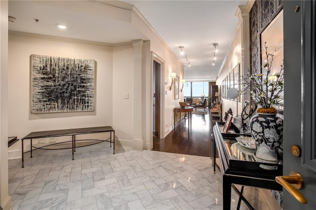 a view of a entryway door and dining room