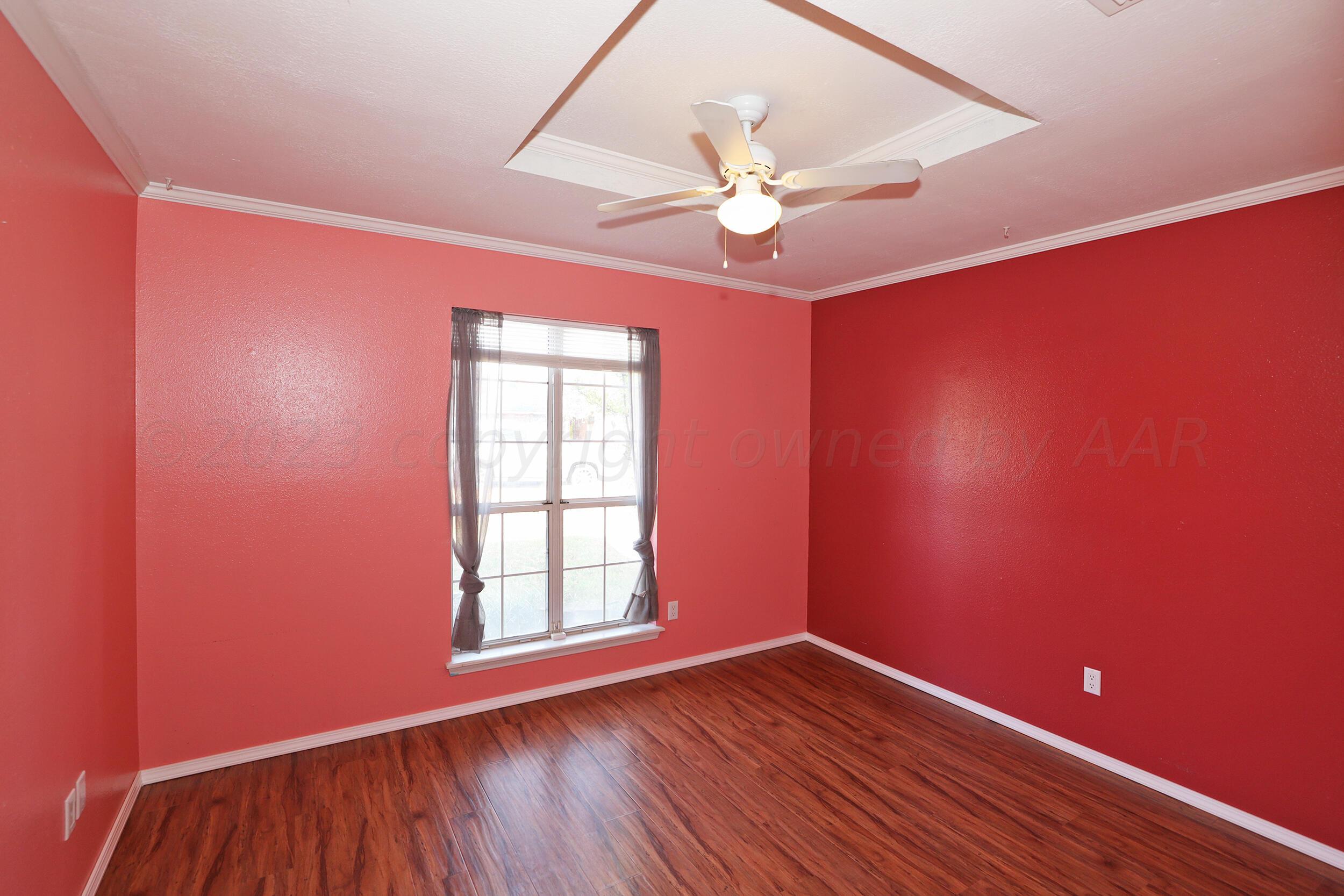 4207 Rincon Avenue Amarillo, TX 79110 - Photo 19 of 26 a view of empty room with wooden floor and fan