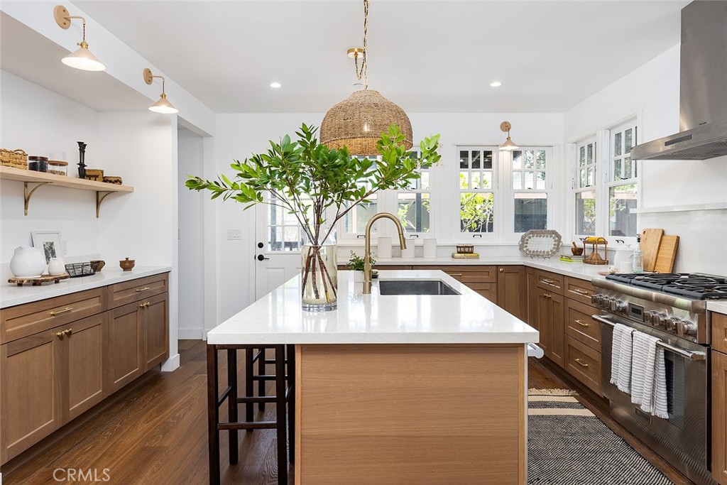 1130 Windsor Place South Pasadena, CA 91030 - Photo 10 of 35 a kitchen with stainless steel appliances a sink a stove a table and chairs