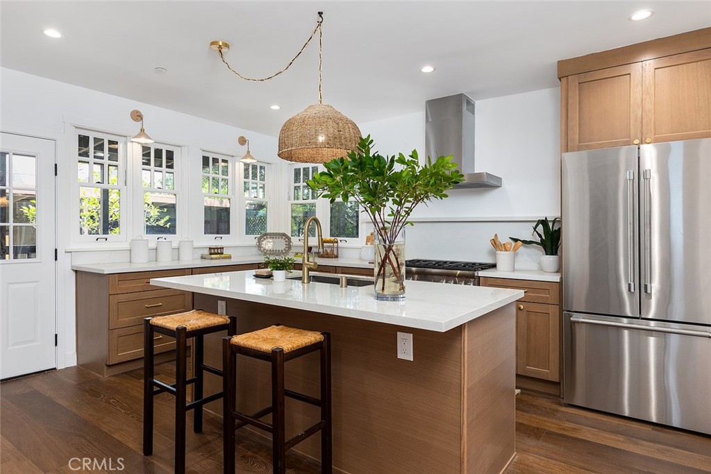 1130 Windsor Place South Pasadena, CA 91030 - Photo 11 of 35 a kitchen with kitchen island granite countertop a sink a center island and stainless steel appliances