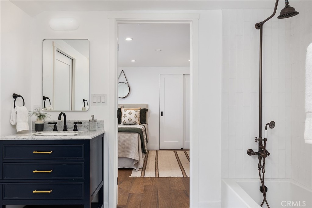 1130 Windsor Place South Pasadena, CA 91030 - Photo 26 of 35 a en suite bathroom with a double vanity sink a mirror and shower