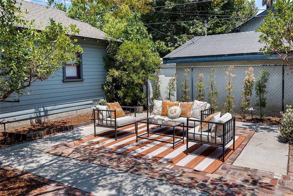 1130 Windsor Place South Pasadena, CA 91030 - Photo 32 of 35 a backyard of a house with fire pit and outdoor seating