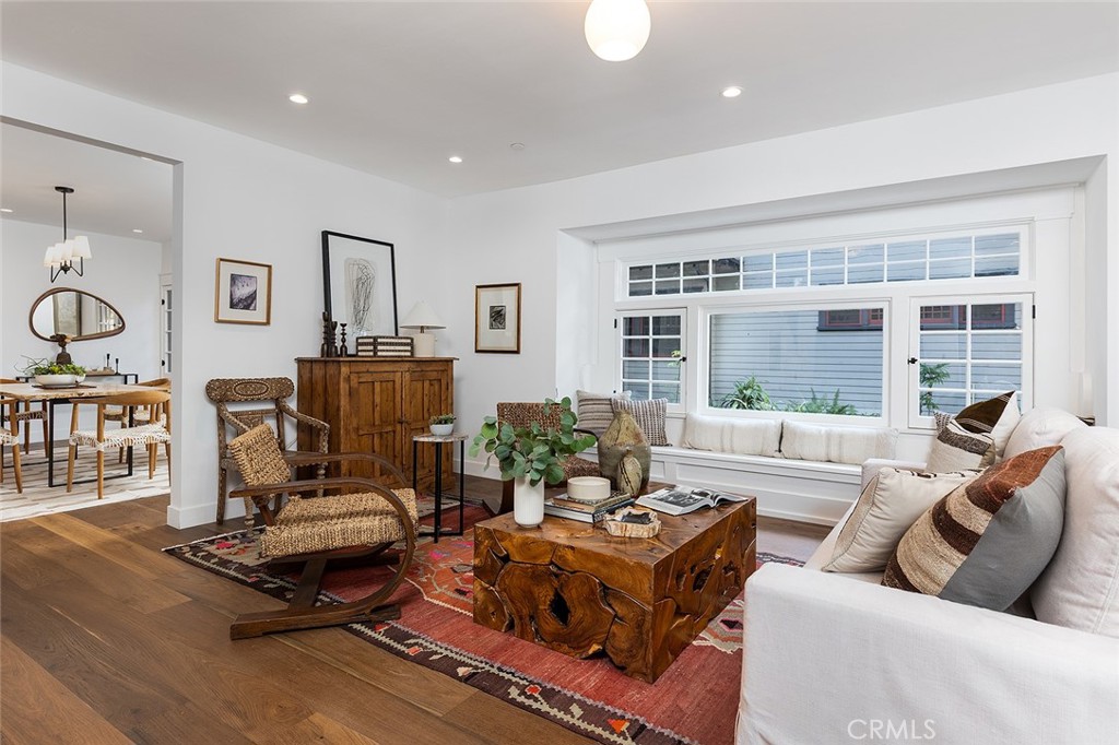 1130 Windsor Place South Pasadena, CA 91030 - Photo 4 of 35 a living room with furniture a flat screen tv and a large window