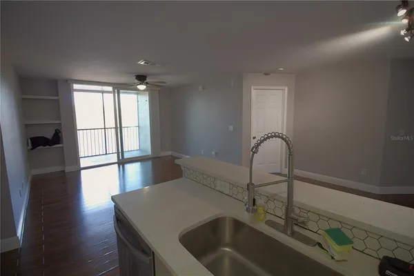 a kitchen with a sink and a refrigerator