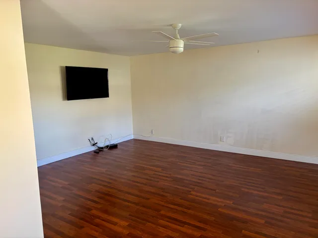 a kitchen with stainless steel appliances a refrigerator sink and microwave