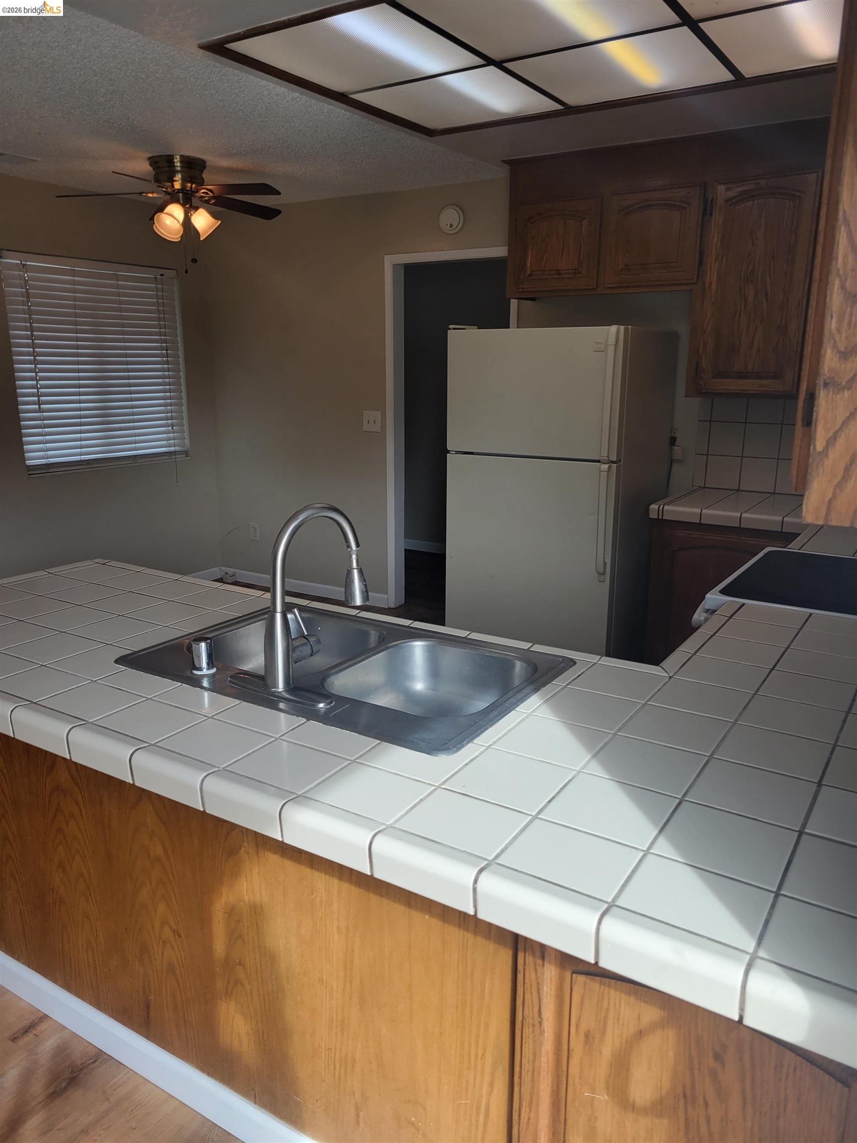 906 Coral Drive Rodeo, CA 94572 - Photo 5 of 21 a kitchen with a sink and cabinets