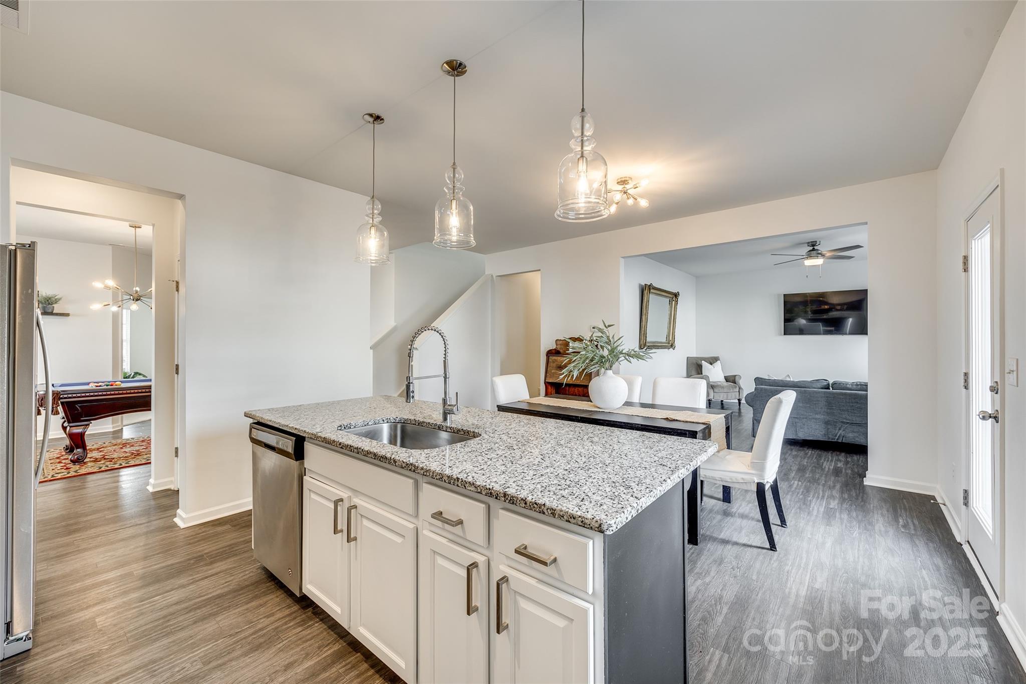 634 Gants Road York, SC 29745 - Photo 13 of 42 a kitchen with stainless steel appliances granite countertop a kitchen island a stove and a wooden floors