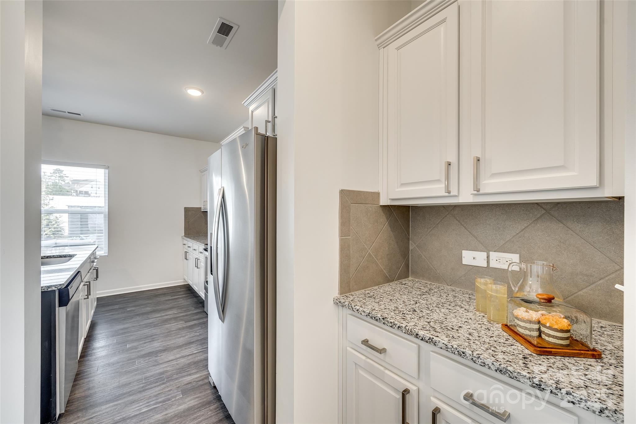 634 Gants Road York, SC 29745 - Photo 15 of 42 a kitchen with granite countertop white cabinets and refrigerator