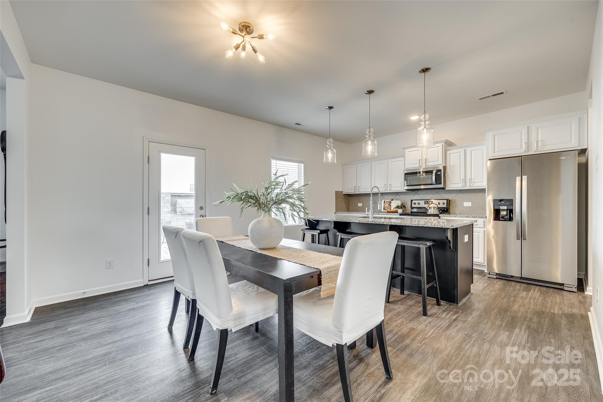 634 Gants Road York, SC 29745 - Photo 16 of 42 a view of kitchen with refrigerator a dining table and chairs