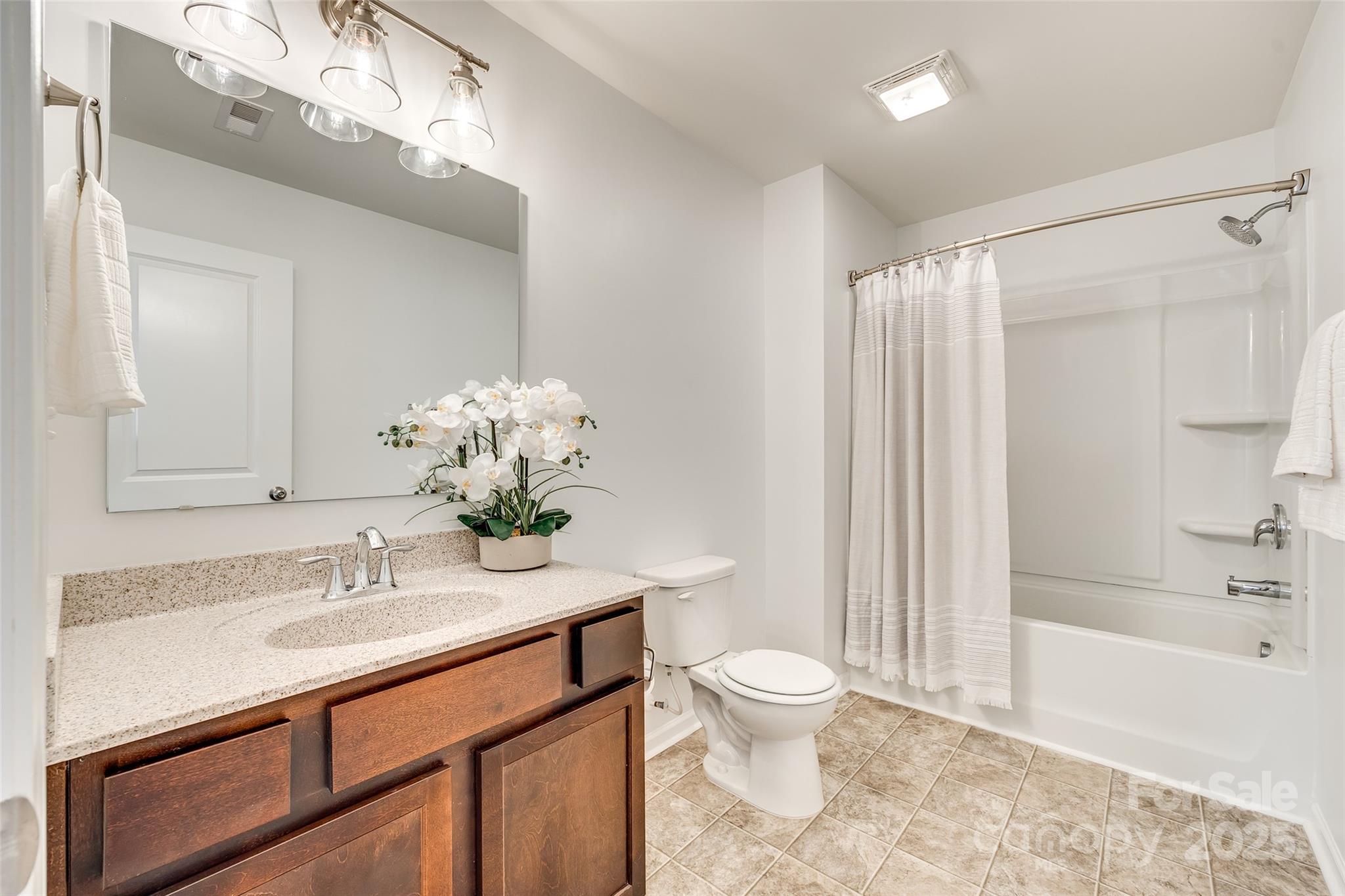 634 Gants Road York, SC 29745 - Photo 33 of 42 a bathroom with a granite countertop sink a toilet and shower