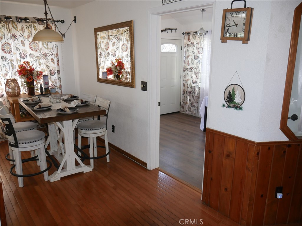 1610 North Grass Valley Road Lake Arrowhead, CA 92352 - Photo 12 of 28 a view of a workspace with furniture and chandelier