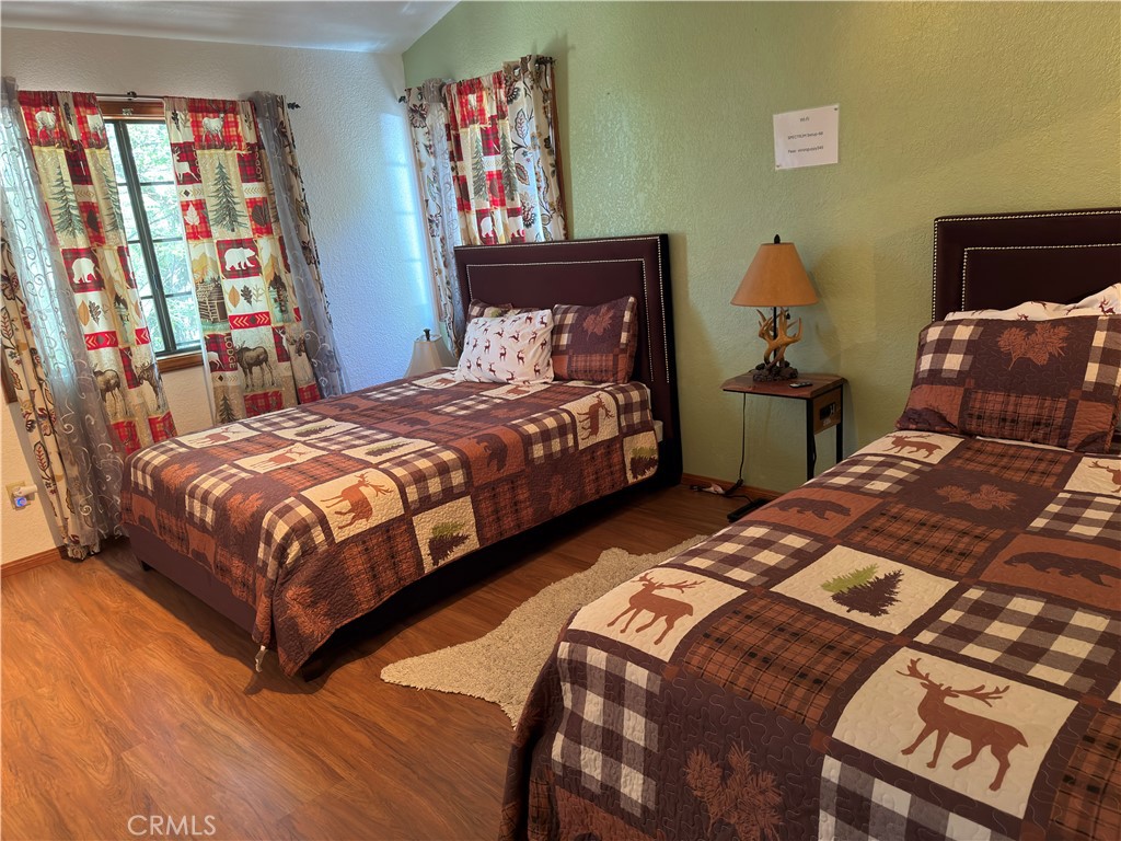 1610 North Grass Valley Road Lake Arrowhead, CA 92352 - Photo 17 of 28 a bedroom with two beds and painting on the wall